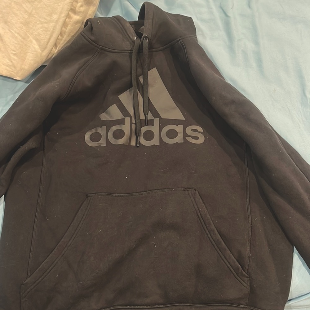 This is a black hoodie in normal condition and is a size large in women